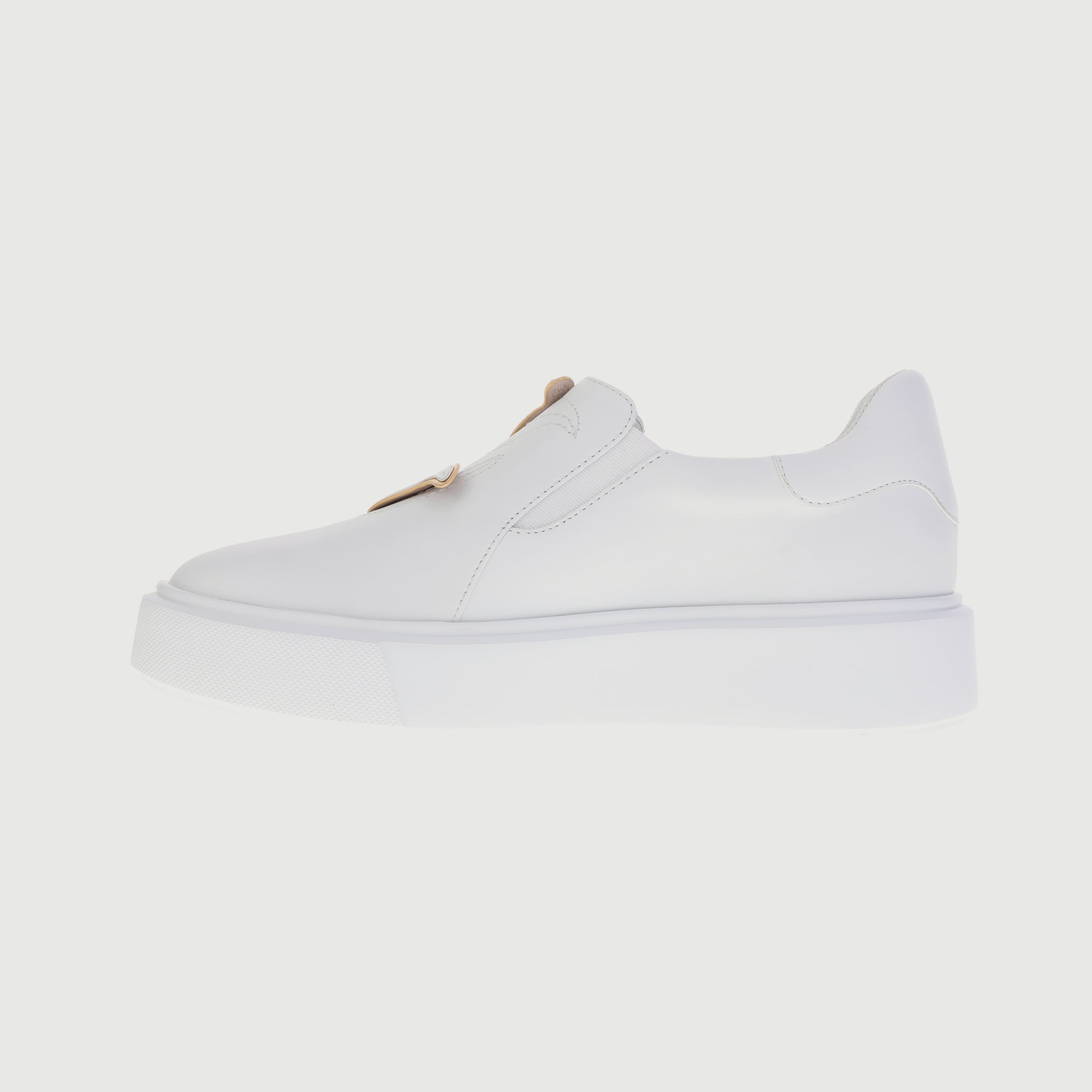 All-white sneakers with embedded leaves