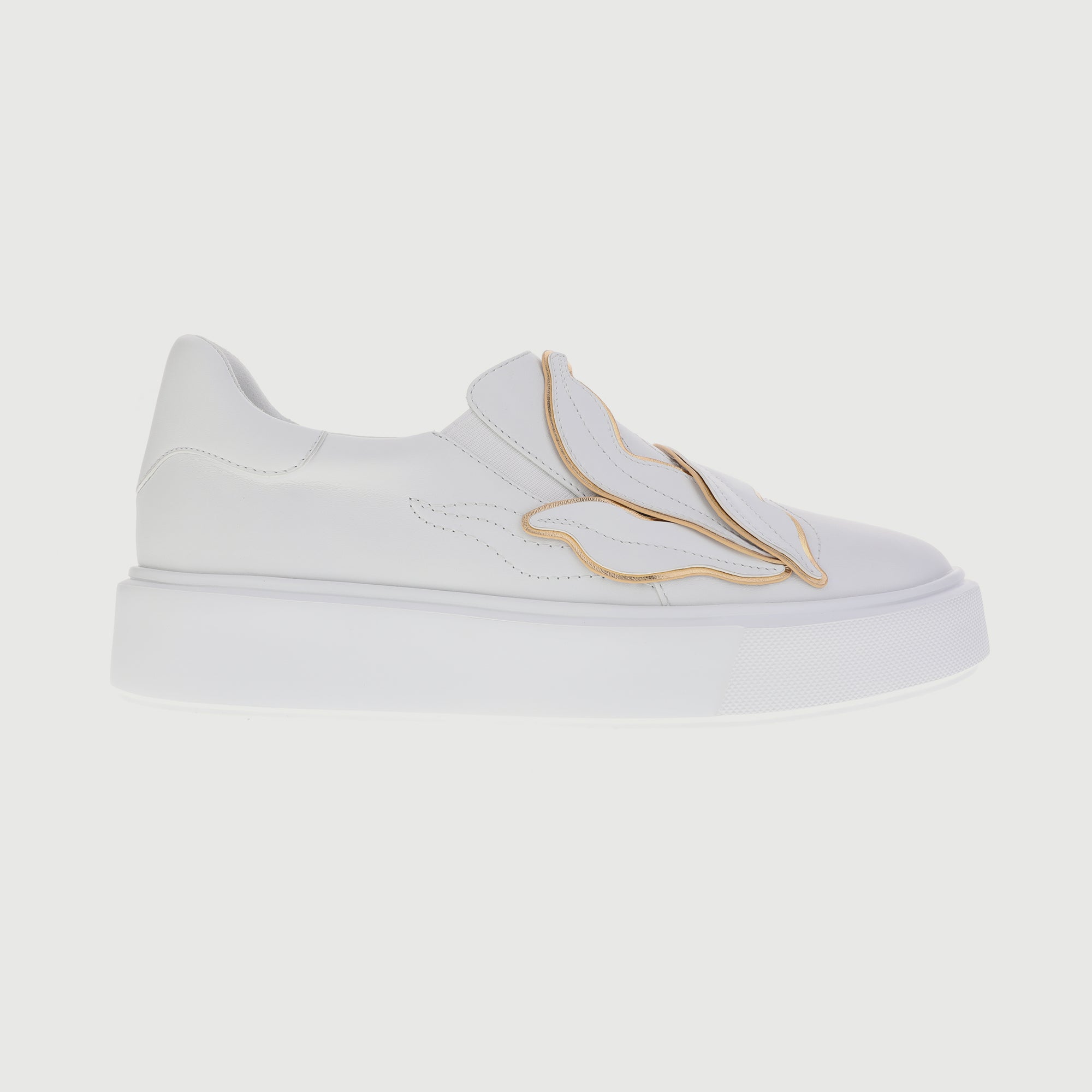 All-white sneakers with embedded leaves