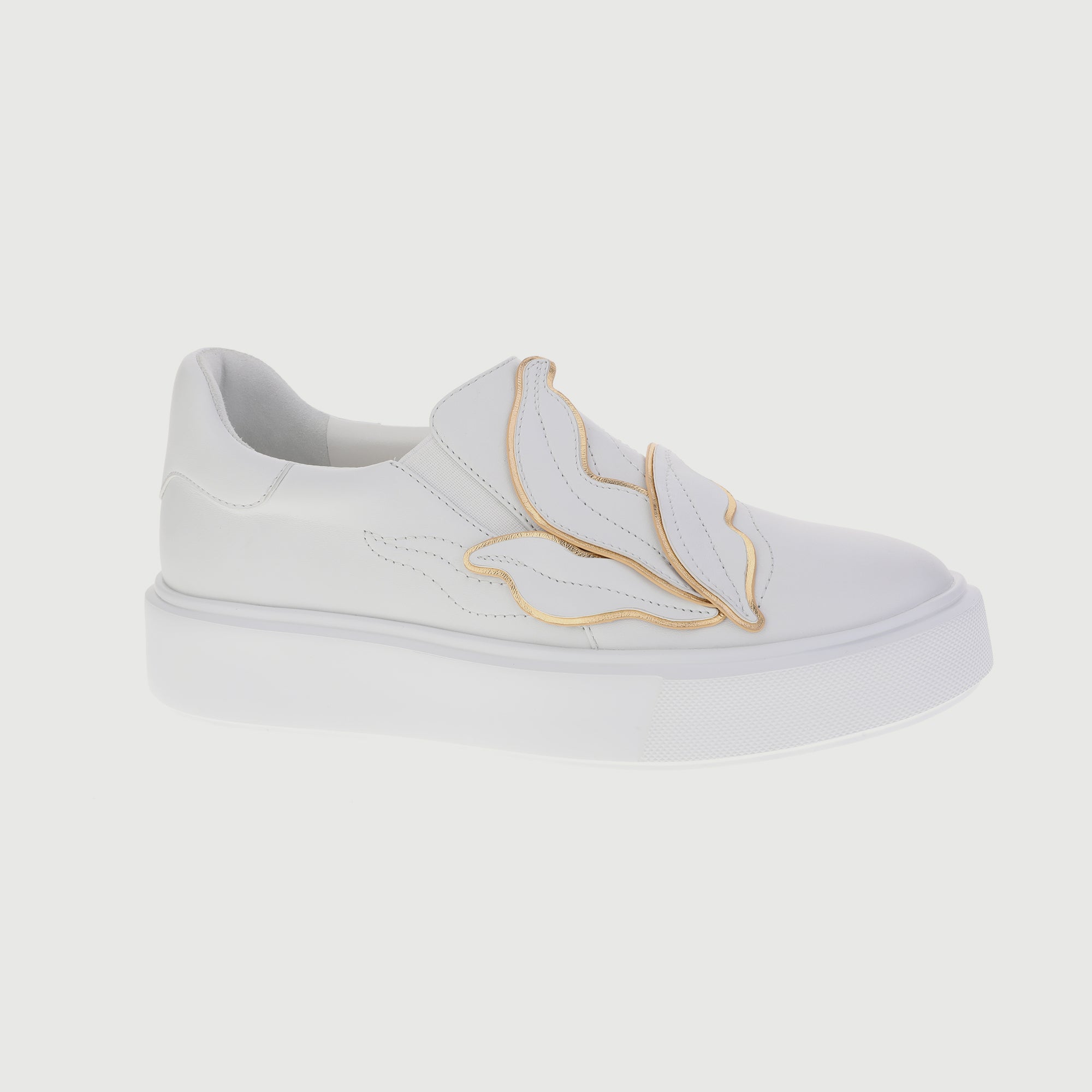 All-white sneakers with embedded leaves