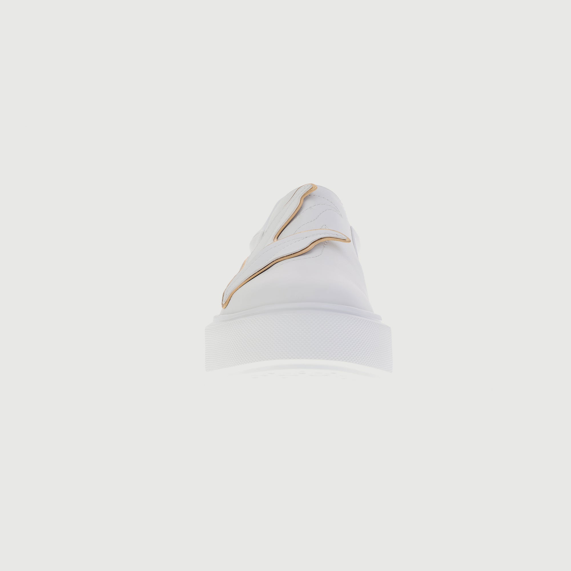 All-white sneakers with embedded leaves